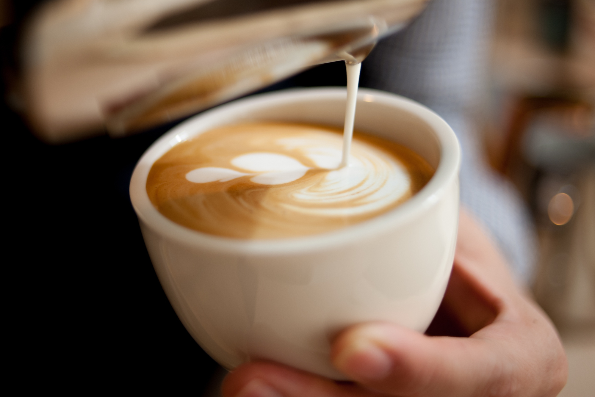 Coffee being poured in a cup.