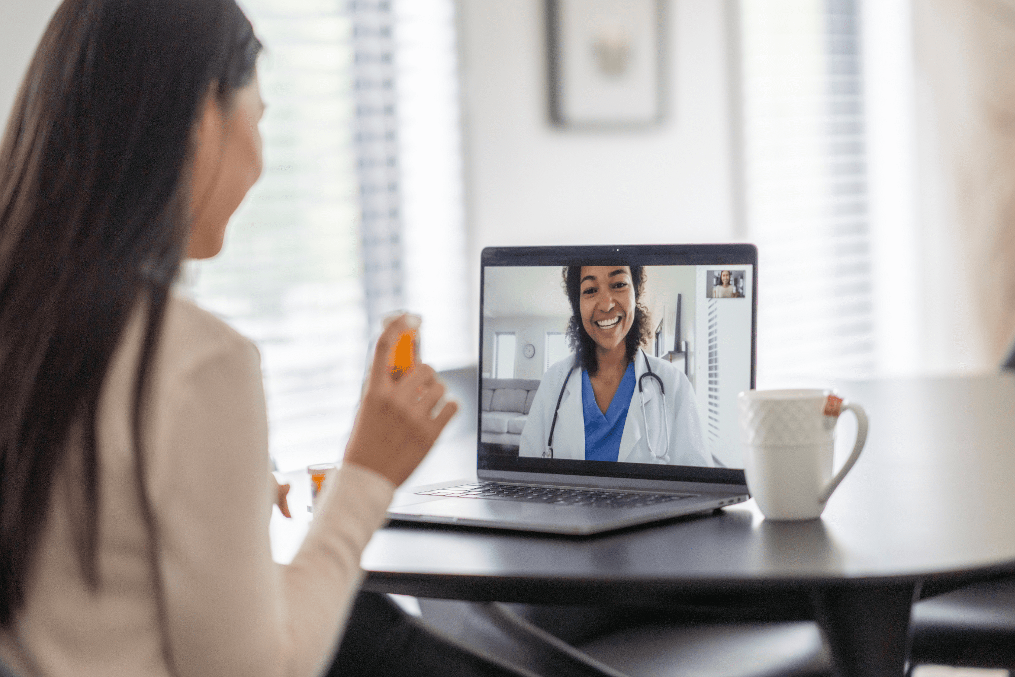 Woman discussing at-home hormone testing with doctor during telehealth video call.