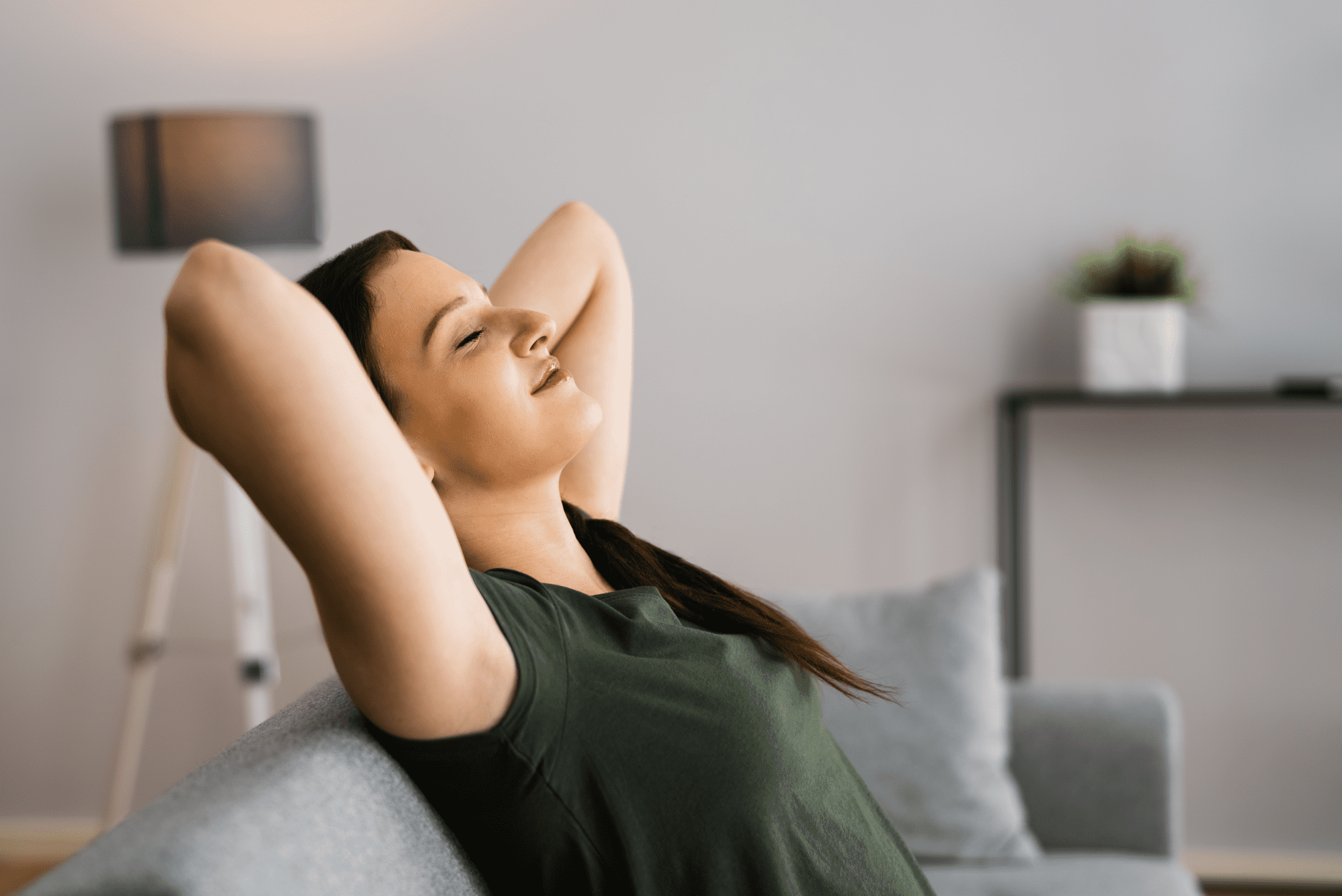 Woman with eyes closed and head tilted back.