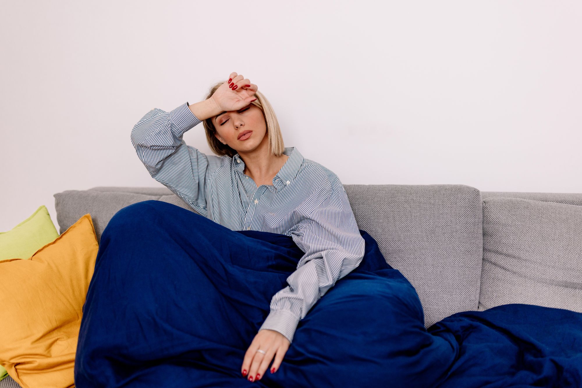 A woman appearing fatigued or unwell, illustrating the effects of low testosterone in women.